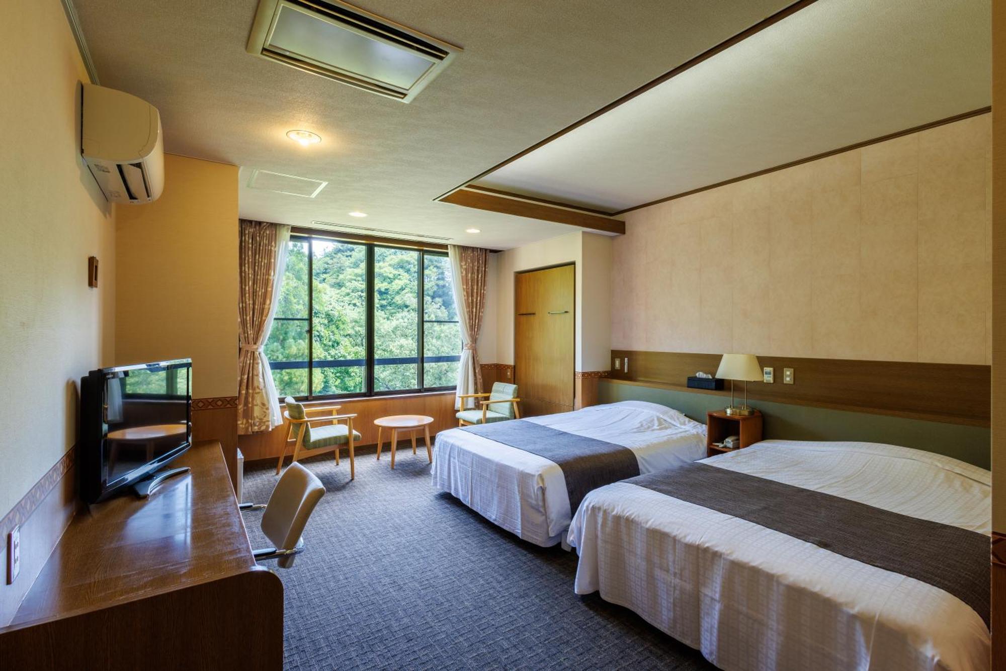 Okutamaji Hotell Ome Eksteriør bilde